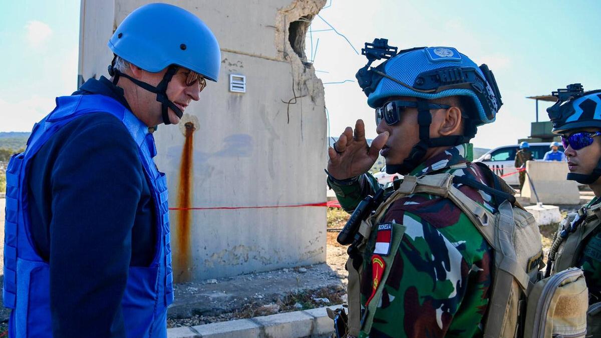 Jean-Pierre Lacroix talks with a peacekeeper.