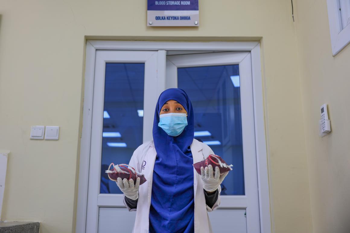 A medical officer poses with blood samples at the National Blood Bank Center in Mogadishu, Somalia, on 14 April 2025.
